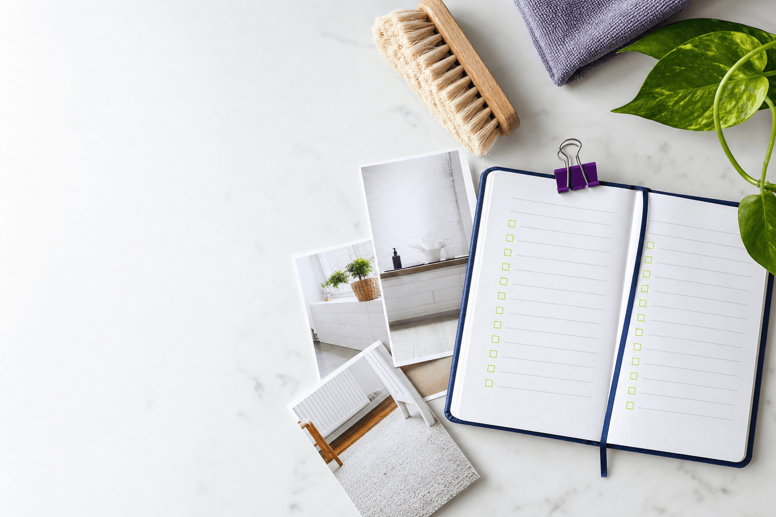 Notebook, checklist, and household planning notes on a kitchen table